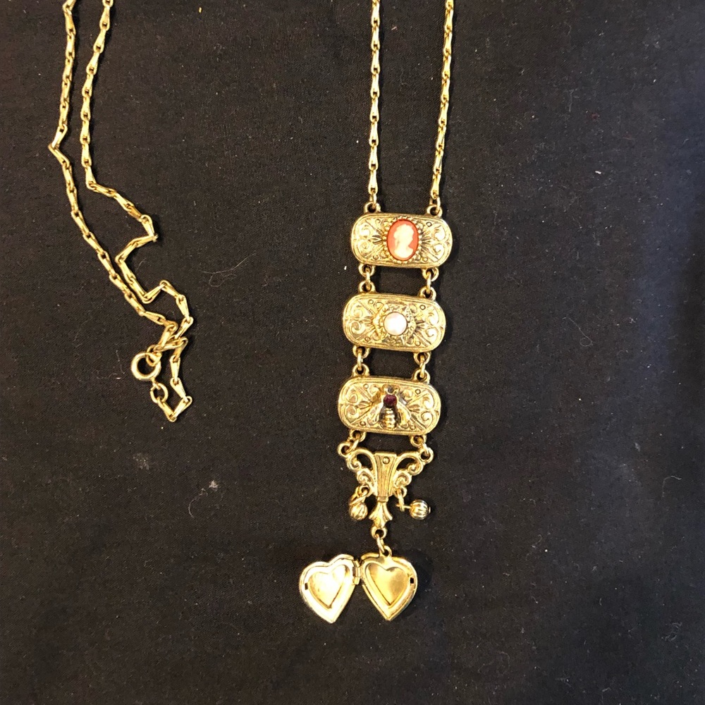Gold necklace with small locket